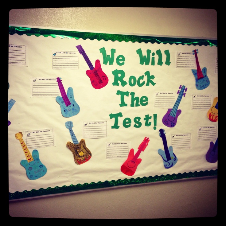 we will rock the test bulletin board with colorful guitars on it and words written in green