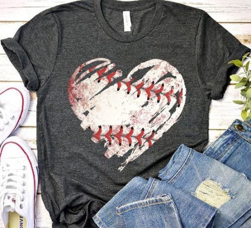 a t - shirt with a baseball heart on it and some jeans next to it