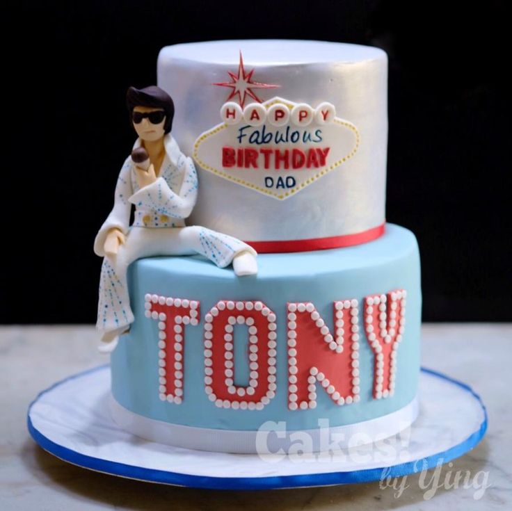 a birthday cake with the name tony on it and a star wars figurine sitting on top