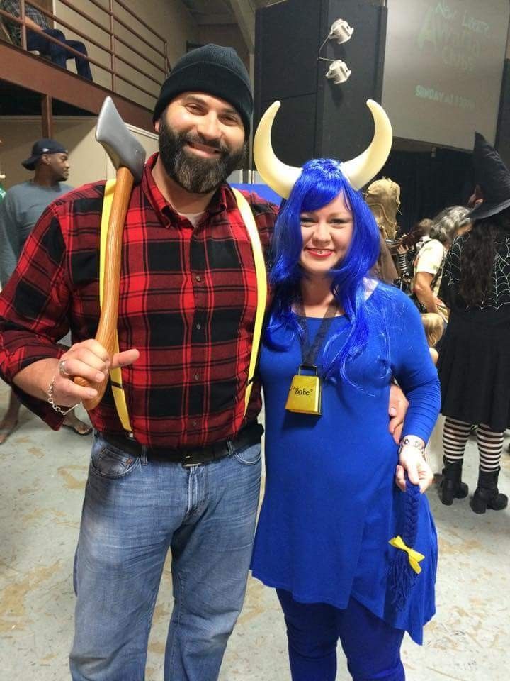 a man and woman dressed up in costumes