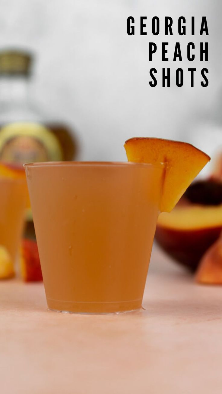 there is a glass with some peaches in it