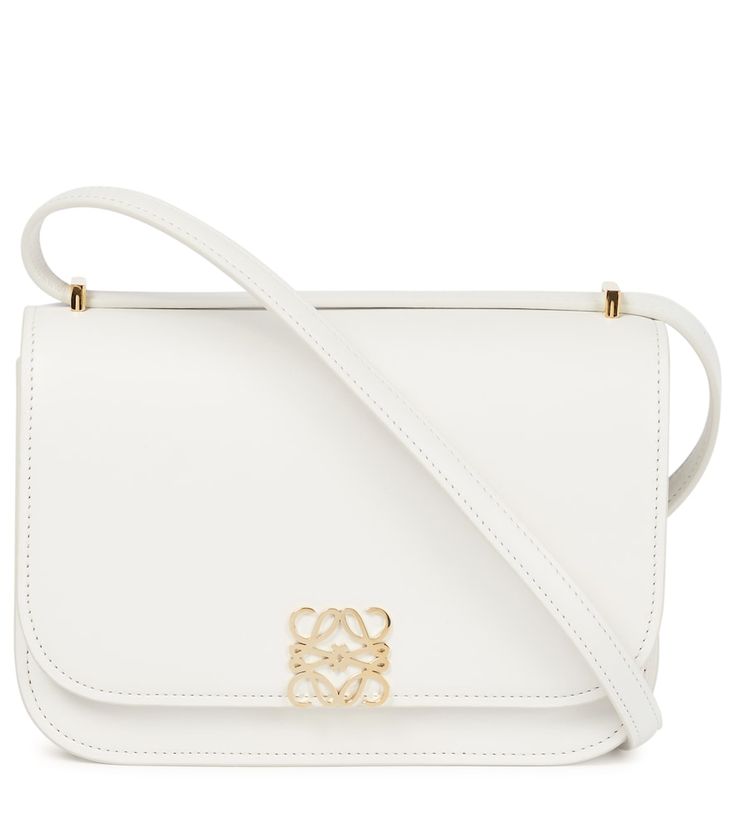 LOEWE's Goya Small bag is the ultimate expression of fine Spanish craftsmanship. A clean design with a golden Anagram closure, it's made in the house's Madrid atelier from soft white silk calfskin leather and lined in contrasting nappa. It comes with a sliding shoulder strap that allows it to be worn across the body or doubled up as a shoulder bag. White Silk, Together We Can, Bags Designer Fashion, Soft White, Small Bag, Vintage Accessories, Leather Shoulder Bag, Calf Leather, Calf Skin