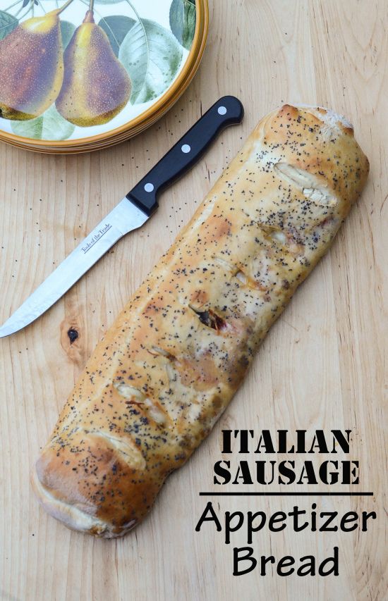 a loaf of bread sitting on top of a cutting board next to a knife