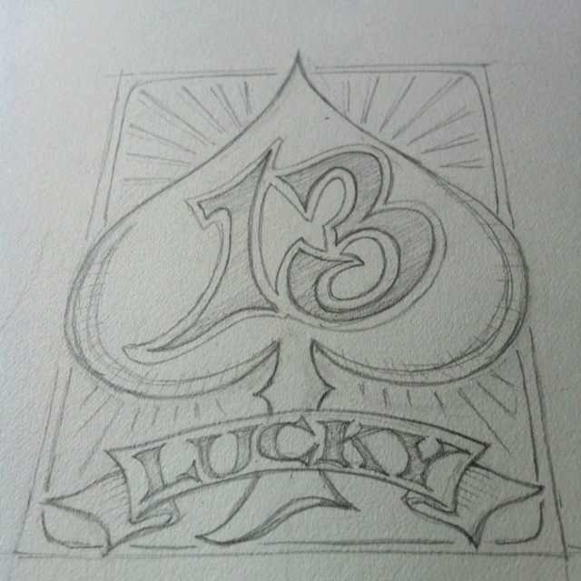 the logo for lucky's casino is drawn in pencil on paper with an ink pen