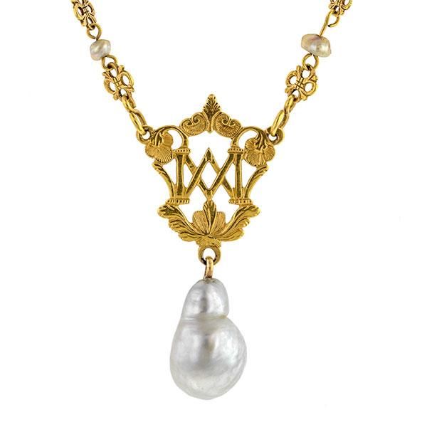 An ornate, openwork plaque with letters, accented by a filigree link chain stationed with fresh water pearls and finished with baroque pearl drop, pendant measures 1 3/4 inches long, fashioned in 18k yellow gold (tested) with 10k yellow gold clasp. Circa 1880. Length 16 inches. Antique Pearl Pendant Necklace For Formal Occasions, Classic Baroque Jewelry With Pearl Drop, Classic Baroque Pearl Drop Jewelry, Formal Baroque Pearl Necklace With Pearl Charm, Baroque Pearl Drop Necklace For Formal Occasions, Formal Baroque Pearl Necklace With Charm, Luxury Baroque Pearl Charm Jewelry, Luxury Baroque Pearl Drop Jewelry, Formal Baroque Pearl Drop Necklace