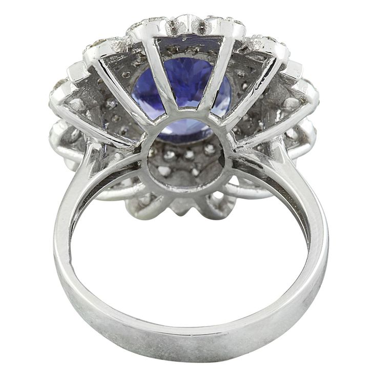 Stamped: 14K Total Ring Weight: 7.1 Grams Tanzanite Weight 6.00 Carat (12.00x9.60 Millimeters)Diamond Weight: 1.00 carat (F-G Color, VS2-SI1 Clarity )Face Measures: 22.55x19.95 Millimeter SKU: [600533] Formal Gia Certified Cluster Ring, Formal Cluster Sapphire Ring With Vvs Clarity, Formal Vvs Clarity Cluster Sapphire Ring, Gia Certified Cluster Halo Ring For Formal Occasions, Formal Gia Certified Cluster Halo Ring, Formal Tanzanite Round Cut Diamond Ring, Formal Tanzanite Diamond Ring With Round Cut, Tanzanite Brilliant Cut Formal Rings, Classic Tanzanite Rings With Brilliant Cut