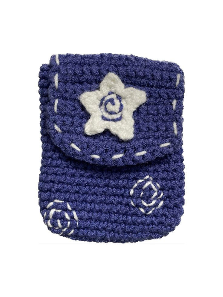 a blue crocheted cell phone case with a flower on the front and side