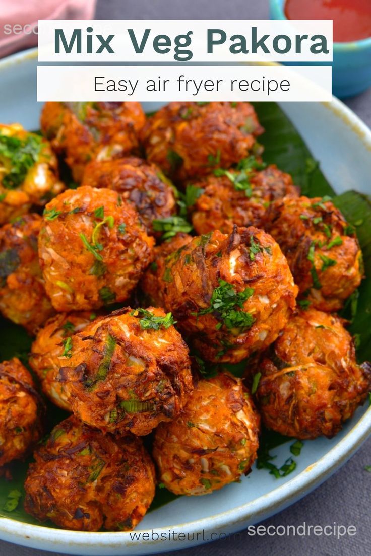 a white plate topped with meatballs covered in sauce