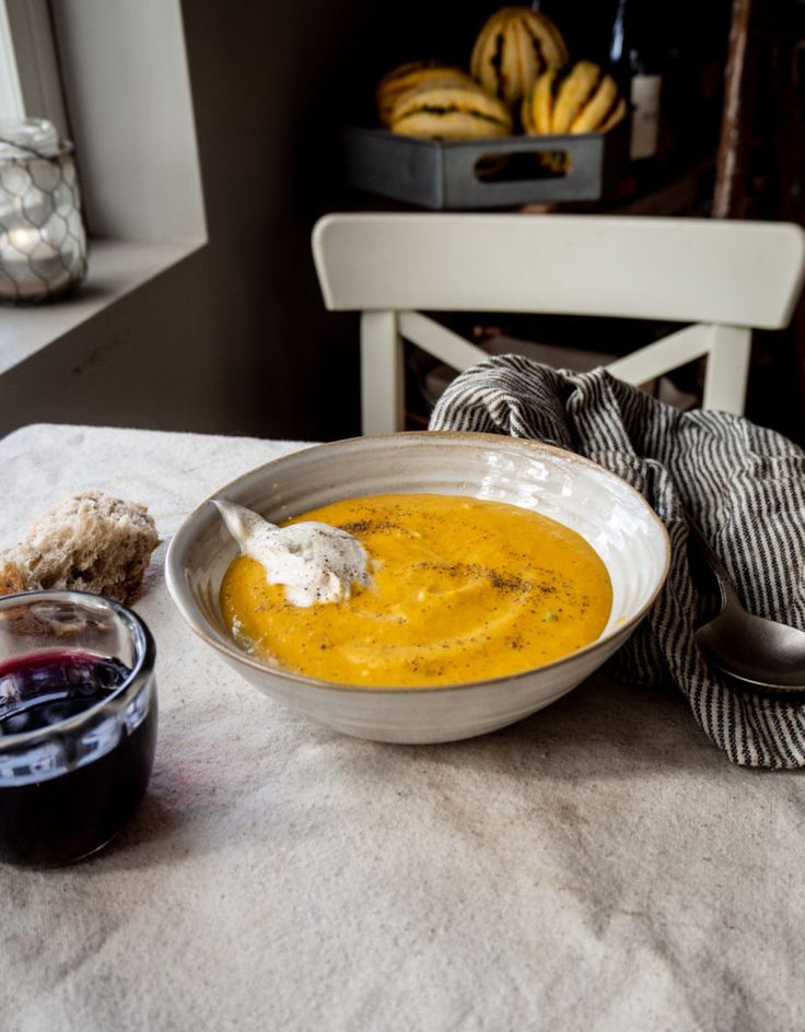 there is a bowl of soup on the table