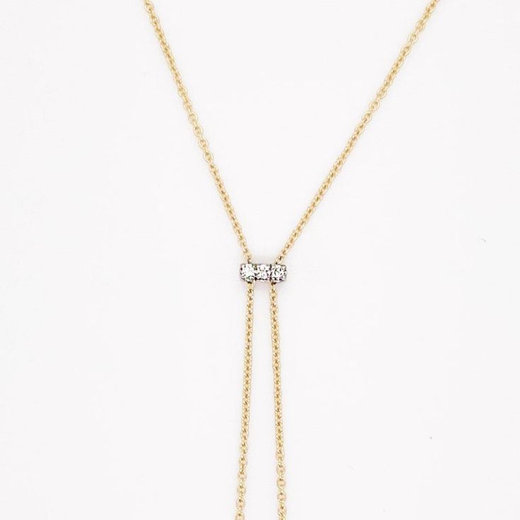 This striking makes quite an iconic statement with diamonds in the center and on the ends of the bars. It hangs beautifully on anyone’s neck and is great with a v shape or rounded neckline. We had one client buy this necklace for their wedding dress. Casual or dressy this necklace is a show stopper! The chain is solid 14 karat yellow gold and the diamonds are all set in 14 karat white gold to show off the diamonds. The details for this beautiful necklace are listed below:Metal Quality: 14K Yello Elegant Formal Diamond Necklace With Adjustable Chain, Timeless Formal Chain Necklace With Diamond Accents, Elegant Bridal Necklace With Adjustable Chain For Formal Occasion, Luxury Wedding Drop Necklace With Diamond Accents, Elegant Formal Lariat Necklace With Adjustable Chain, Elegant Bridal Necklace With Adjustable Chain And Cubic Zirconia, Elegant Diamond Chain Necklace With Adjustable Chain, Elegant Single Cut Diamond Chain Necklace For Formal Occasions, Elegant Formal Chain Necklace With Single Cut Diamonds