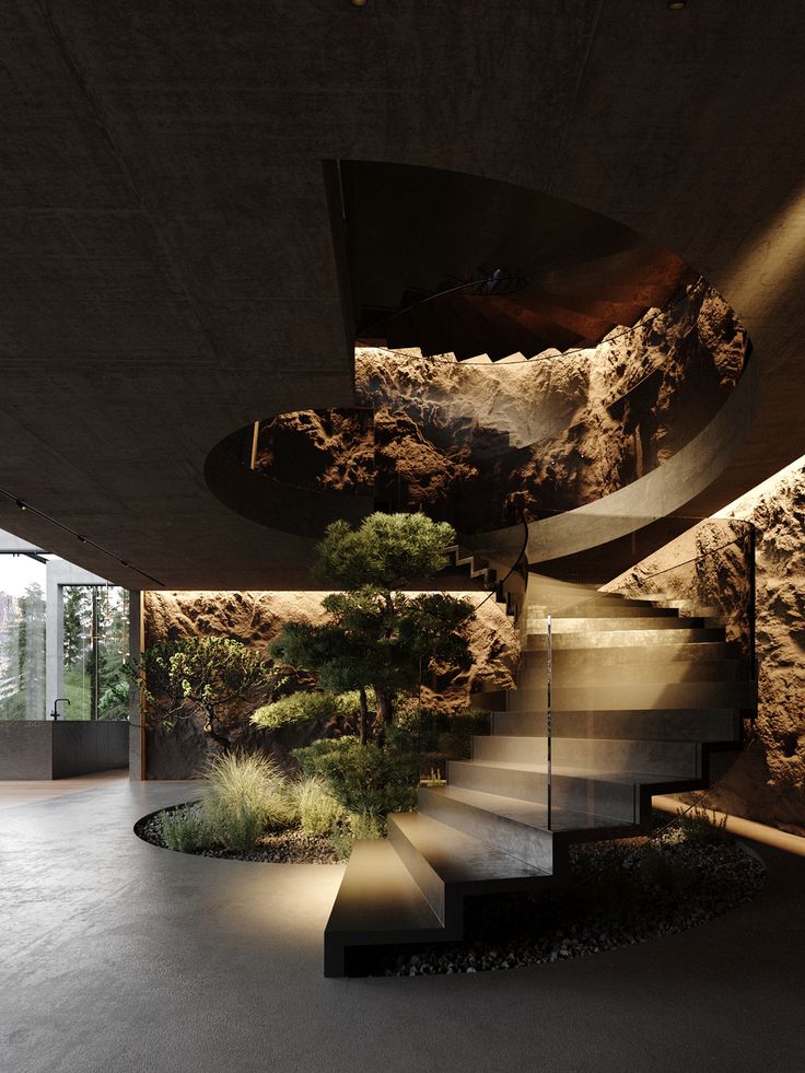 an indoor area with stairs, trees and rocks