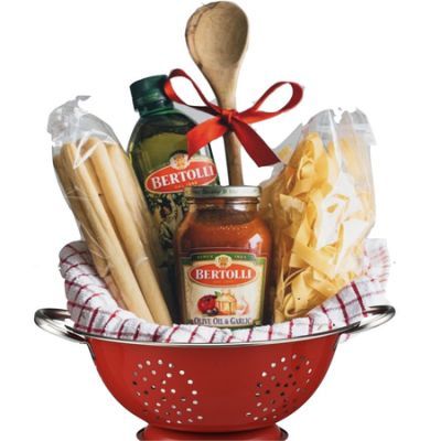 a red colander filled with condiments, pasta and cheese sticks in it