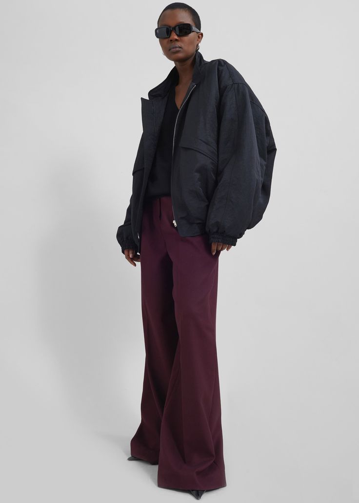 Color: Burgundy Midweight woven fabric Regular fit Wide leg Mid-rise Belt loops Side seam pockets Back illusion welt pockets Zip fly Asymmetric front button closure Unlined 77% Polyester 21% Rayon 2% Elastane Dry Clean By The Frankie Shop. Imported Baggy Workwear Outerwear With Pockets, Versatile Relaxed Fit Parachute Pants For Fall, Chic Straight Leg Parachute Pants For Work, Oversized Ankle-length Pants With Pockets, High-waisted Wide Leg Pants With Welt Pockets For Fall, Oversized Wide Leg Pants For Workwear, Oversized Wide Leg Pants For Fall Workwear, Fall Elevated Casual Cargo Pants, Fall Cargo Pants For Elevated Casual Occasions