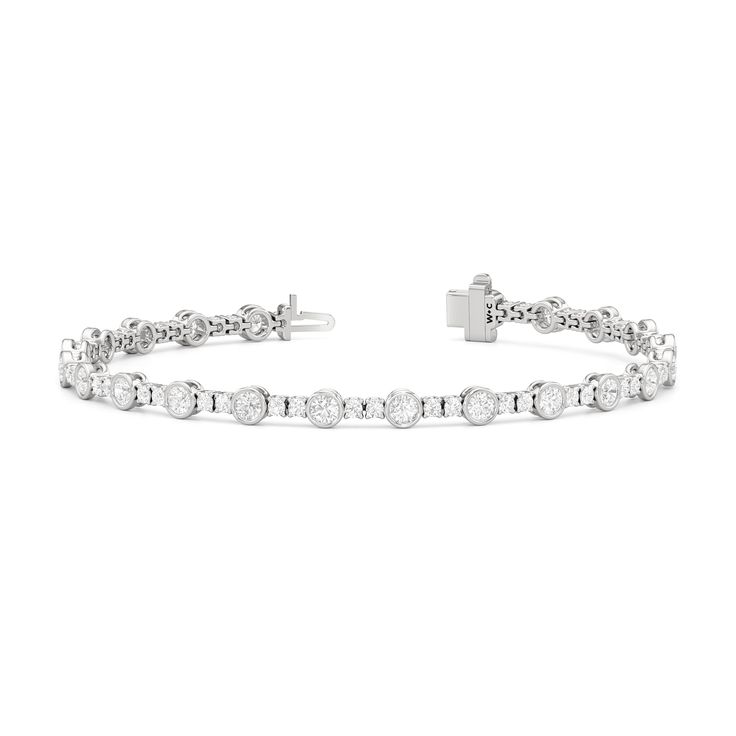 A testament to our vision of harmonizing luxury and simplicity. This tennis bracelet features a continuous line of round diamonds laid out in a pattern of one alternating bezel-set round diamond and a duo of claw prong-set round diamonds. The bracelet's understated design showcases the unparalleled fire and brilliance of the most popular diamond shape. Classic Diamond Bracelet With Channel Set, White Gold Diamond Bracelet With Bezel Setting, Classic Round Cut Channel Set Diamond Bracelet, Modern White Round Diamond Bracelet, Timeless Diamond Bracelet With Bezel Setting, Modern Round Bracelet With Bezel Setting, Modern Round Bracelets With Bezel Setting, Classic Round Tennis Bracelet With Bezel Setting, Timeless Round Channel Set Bracelets