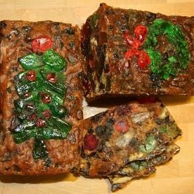 four pieces of food sitting on top of a wooden table