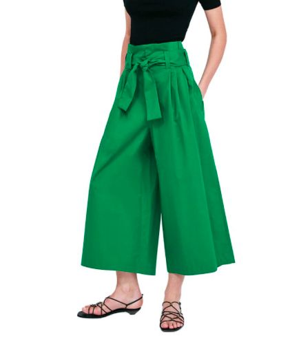 These ankle pants are both sassy and sweet. Featuring a high waist with wide sash belt, pleated front front, flare legs that fall just above the ankle and front pockets... YES FRONT POCKETS. These pants pair perfectly with wedges, heels or sandals. Made with a polyester and cotton blend for comfort and style. Comes in two fabulous colors from which to choose. Chic Wide-leg Culottes For Day Out, Chic High-waisted Pants With Tie Waist, Chic High-waisted Tie Waist Pants, Casual Wide-leg Pants With Belted Cuffs, Trendy Tie Waist Workwear Bottoms, Trendy Workwear Bottoms With Tie Waist, Trendy Flared Pants With Belt Loops, Wide Leg Pants With Tie Waist For Work, Workwear Wide Leg Pants With Tie Waist