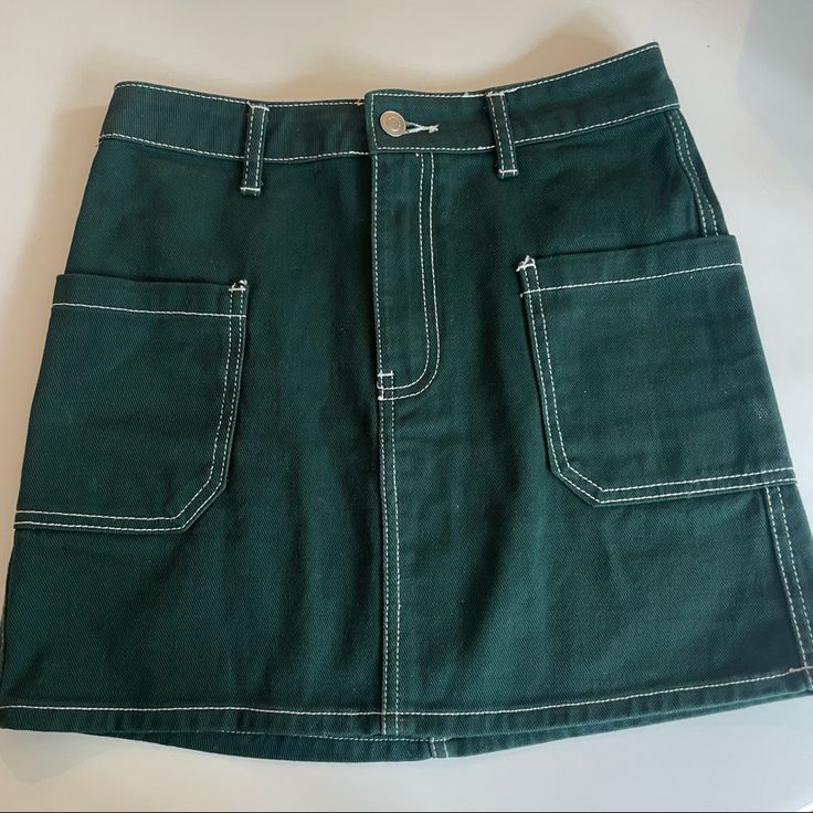 Like New! Never Worn Forever21 Dark Green Skirt With White Stitching And Pockets In Front Trendy High Waist Green Skirt, Trendy High-waist Green Skirt, Green High Waist Cotton Mini Skirt, High Waist Green Cotton Mini Skirt, Trendy Green Mini Skirt With Pockets, Green Mini Cargo Skirt For Spring, Trendy Green Cotton Skirt, Green Mini Length Cargo Skirt For Spring, Trendy High Waist Green Skort