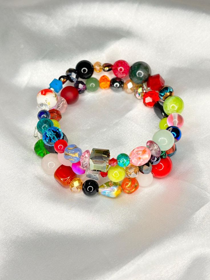 Memory Wired Bracelet consist of glass Czech beads Hand Wrapped Multicolor Crystal Bracelet, Multicolor Hand Wrapped Crystal Bracelet, Adjustable Glass Jewelry For Parties, Colorful Round Beaded Bracelets For Party, Spiritual Beaded Bracelets With Spacer Beads For Party, Spiritual Faceted Beads Bracelet For Party, Spiritual Party Bracelets With Faceted Beads, Round Beaded Bracelets With Spacer Beads For Party, Multicolor Czech Glass Jewelry For Party