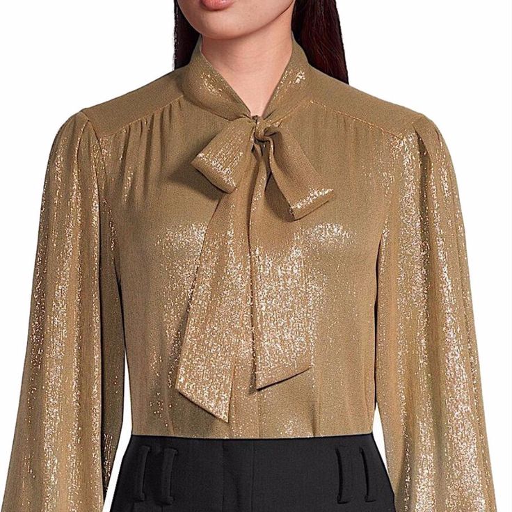 Refined Blouse Featuring Pleated Detailing At The Shoulders, An Elegant Tie Collar, And Shirring Details. Tie-Neck Collar Long Blouson Sleeves Button Cuffs Concealed Button Front Closure Polyester Lining: Viscose/Polyester Hand Wash Imported Of Japanese Fabric. Est. Retail Price: $598.00 Elegant Gold Blouse For Work, Elegant Gold Blouse For Workwear, Designer Gold Blouse For Formal Occasions, Elegant Gold Top With Button Closure, Fitted Tie Neck Blouse With Button Closure, Gold Long Sleeve Office Blouse, Classic Gold Formal Blouse, Designer Gold Blouse For Workwear, Elegant Tie Neck Tops With Button Closure