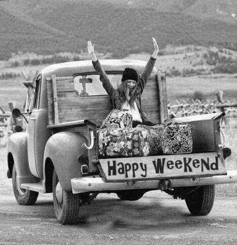 a woman sitting in the back of an old truck