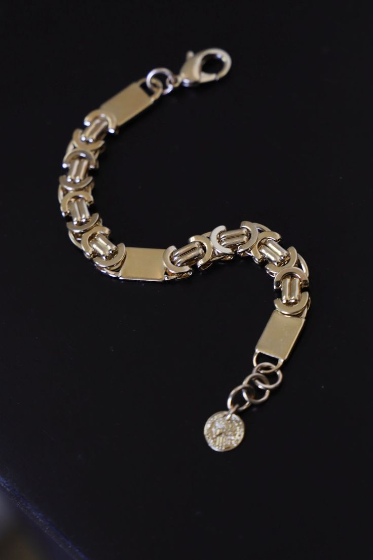 Experience the bold elegance of our Palermo Bracelet - a must-have for any jewelry collection! This stunning bracelet boasts one of our most daring chain styles, adding a touch of sophistication to any outfit. Elevate your look with our Palermo Bracelet today! Material: 24kt gold electroplated brass Measures: 6.5"-7.5" adjustable Tarnish-resistant Sterling Silver Bracelet For Formal Occasions, Elegant Silver Bracelet With Rectangular Links, Elegant Silver Rectangular Link Bracelet, Luxury Stainless Steel Chain Bracelet With Rectangular Links, Luxury Link Chain Bracelets, Luxury Link Bracelets, Modern Silver Charm Bracelet Tarnish Resistant, Luxury Everyday Bracelets With Box Chain, Silver Tarnish-resistant Bangle Chain Bracelet