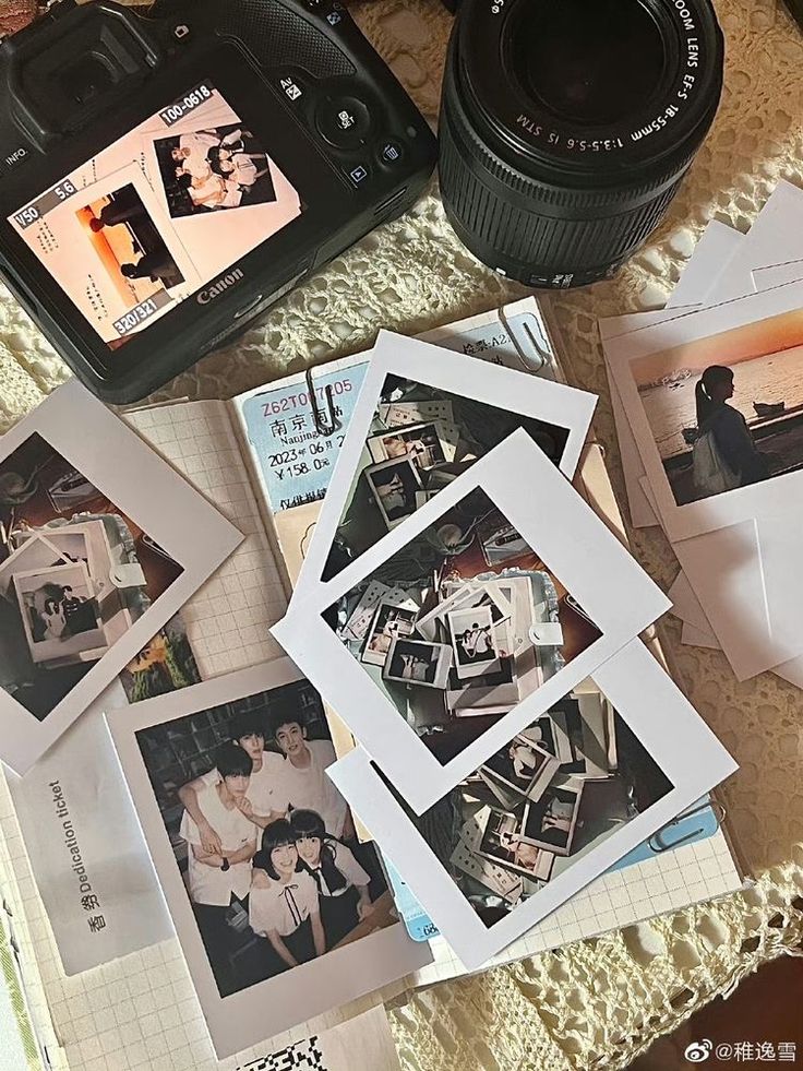 several polaroid pictures and a camera sitting on a table next to some other items