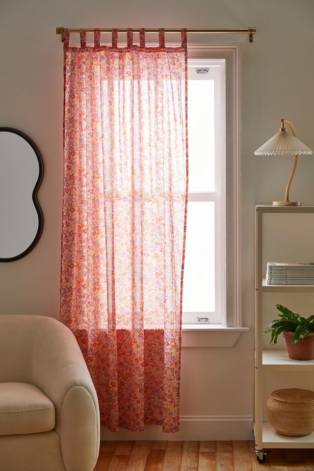 a living room with a chair and window