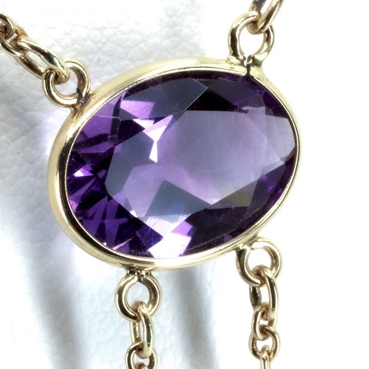 "Vintage Minimalist Lavalier Necklace in 14k Gold with Bezel Set, Oval Cut, Amethysts. This necklace bears a makers hallmark with \"rings and the letter A\", there is also a 14k Purity mark, no origin mark. Necklace measures 15.75\" Total Drop of Lavalier Pendant 1.75\" 1X - 13.6x9.8x5.85 mm Large Amethyst Oval Gem 2X - 7x4.5x3.75 mm Small Amethyst Oval Gems Total weight of necklace 0.179 Oz (78.1 g) This item is vintage. It has been cherished, worn, and preserved by possibly many over the decad Formal Briolette Necklace With Bezel Setting, Delicate Oval Pendant Necklace For Formal Occasions, Minimalist Gemstone Necklace For Formal Occasions, Dainty Gemstone Necklace For Formal Occasions, Dainty Formal Gemstone Necklace, 14k Gold Oval Pendant Necklace For Formal Occasions, Formal 14k Gold Oval Pendant Necklace, Delicate Hallmarked Necklaces For Formal Occasions, Delicate Oval Necklace For Formal Occasions