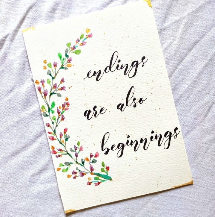 a card with the words ending are all beginnings written in black ink on it