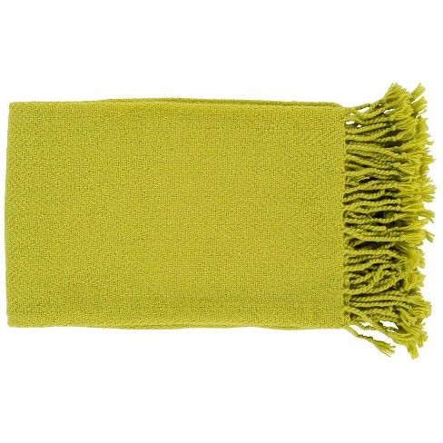 a lime green towel with fringes on the ends and one end folded in half