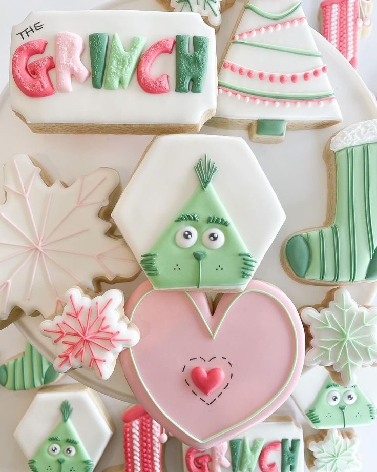 decorated cookies are arranged in the shape of letters