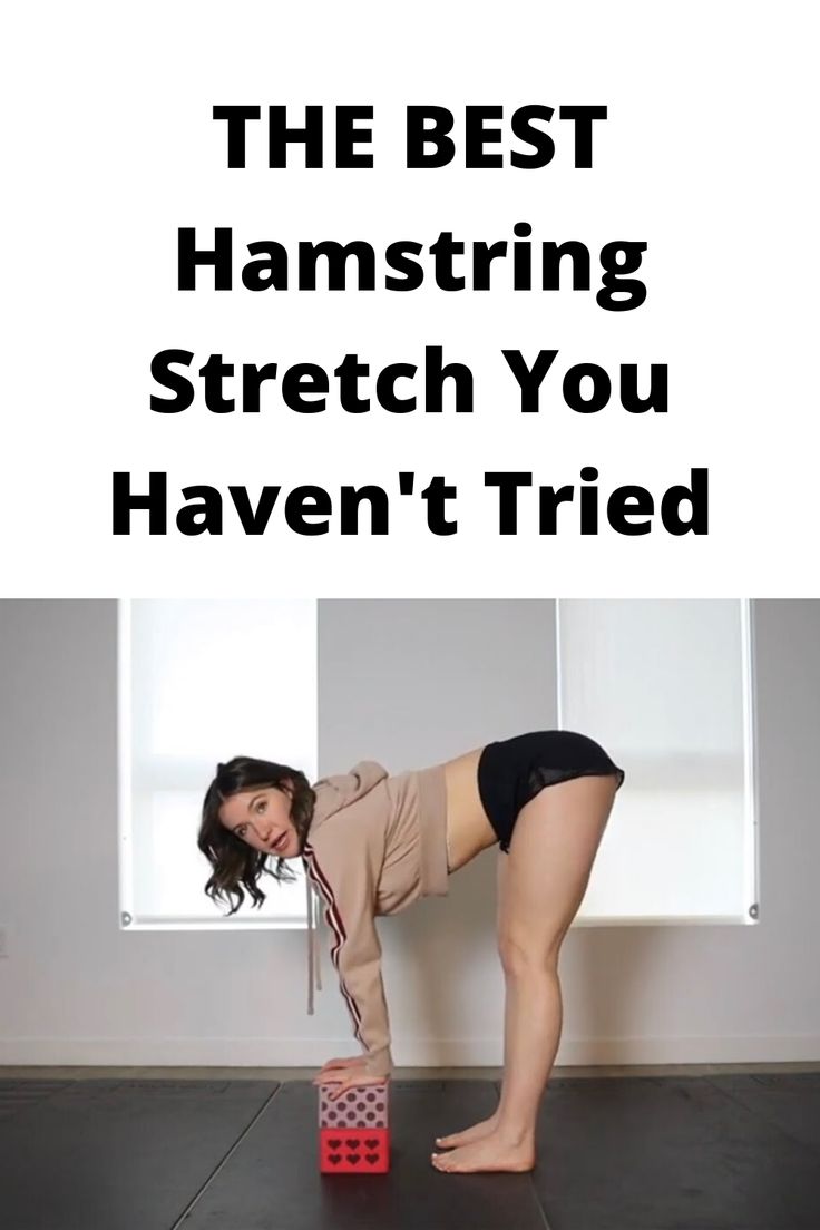 a woman standing on top of a block with the words, the best hamstring stretch you haven't tried