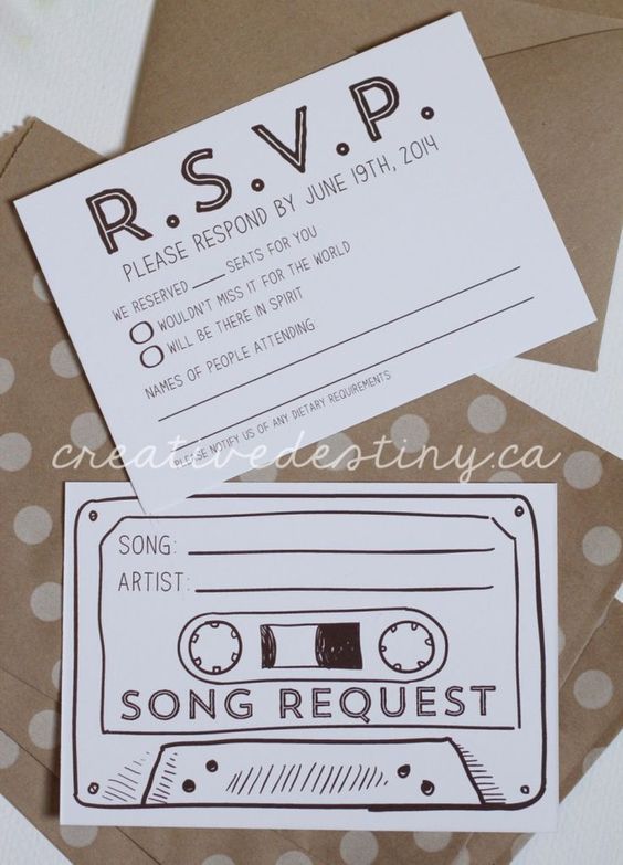 some brown envelopes with white polka dots and a black cassette tape on them, as well as a card that says rsvp