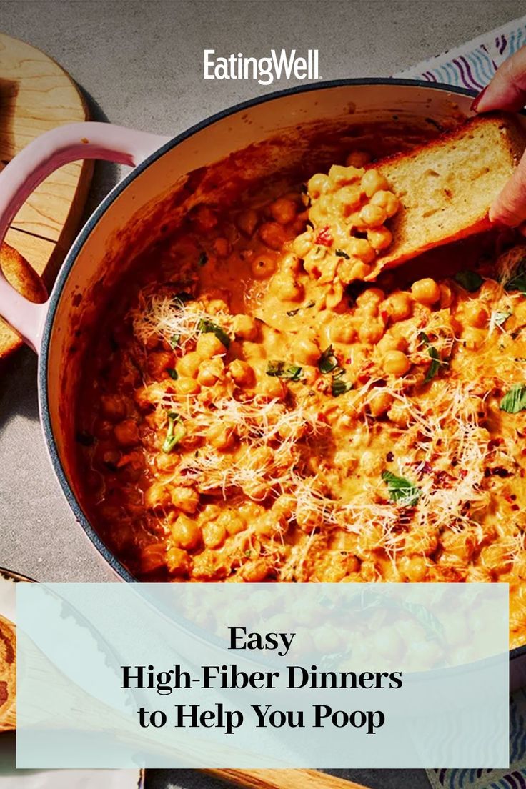 a pan filled with pasta and bread on top of a table