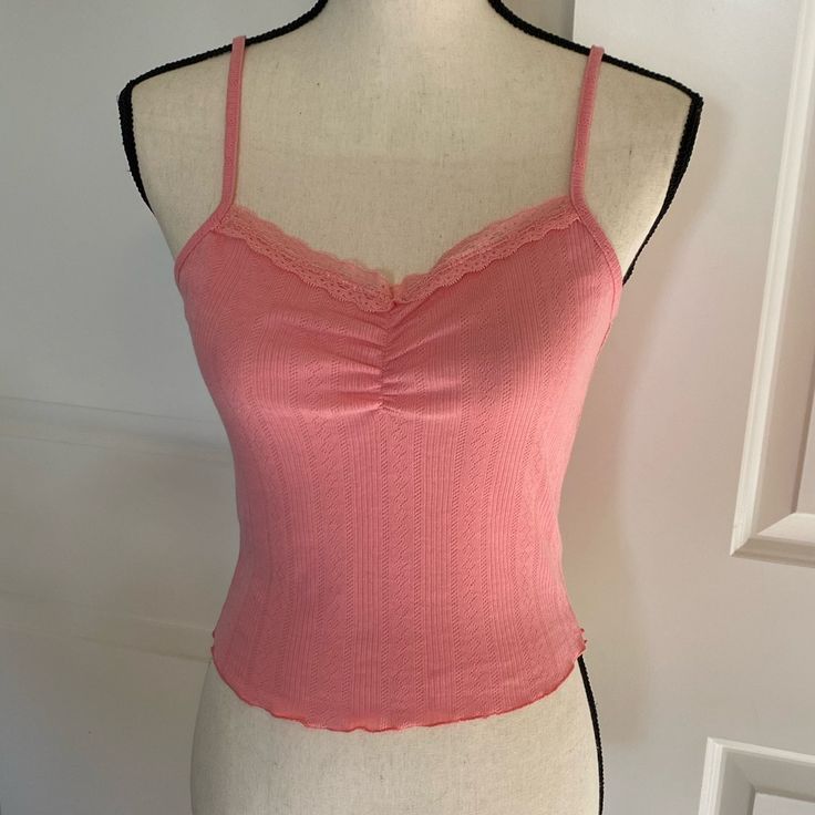 Cute Coral Pink Cami Tank Top. Cropped Length And Feminine Pointelle Texture. Lace Trim And A Gather On The Front. Adjustable Spaghetti Straps. New With Tags. Perfect With A Pair Of Wide Leg Jeans! Also Available In Teal And Coral Floral Print In My Closet. Fitted Top With Delicate Straps For Day Out, Trendy Lace Trim Camisole For Spring, Fitted Tank Top With Delicate Straps For Day Out, Trendy Camisole With Built-in Bra For Spring, Fitted Tops With Delicate Straps For Spring, Pink Camisole For Spring Brunch, Pink Camisole For Brunch In Spring, Fitted Tank Top With Delicate Straps For Spring, Spring Lace Trim Camisole