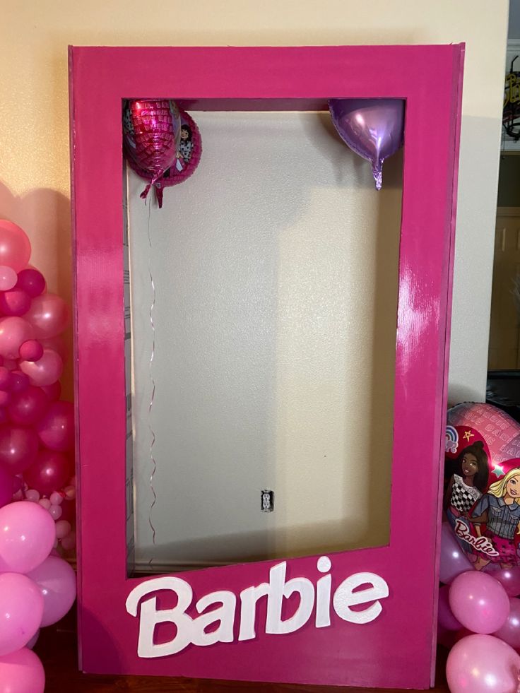 there is a pink frame with balloons around it that says barbie on the front and bottom