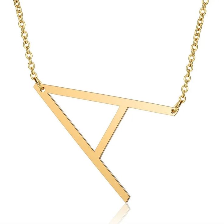 a gold necklace with the letter y on it