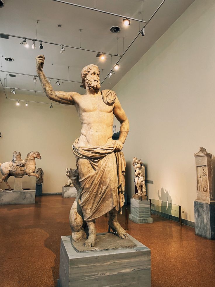 an ancient statue is displayed in a museum