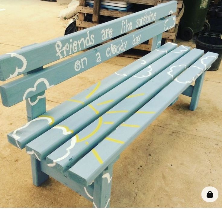 a painted bench that says friends are like sunshine on a cloudy day in front of some pallets