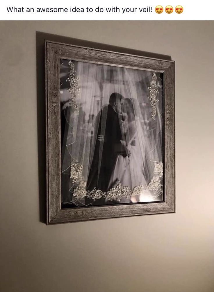 a framed photo hanging on the wall above a toilet