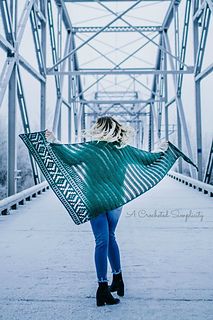 a woman walking across a bridge holding an umbrella