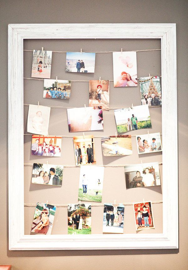 a white frame with pictures hanging on it