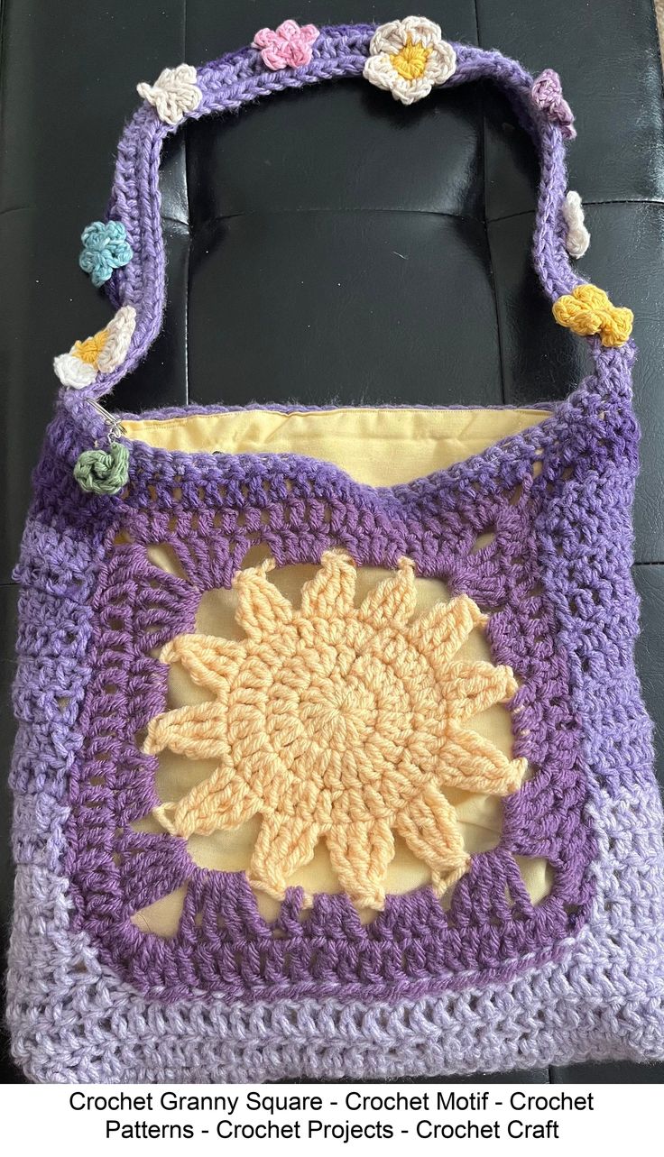 a crochet granny bag sitting on top of a table