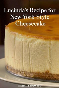 a cheesecake on a white plate with the words lucia's recipe for new york style cheesecake