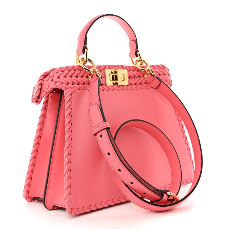 This is an authentic FENDI Vitello King Shiny Nappa Intreccio Small Peekaboo I SEE U Satchel in Pink Dalia. This stylish tote is crafted of smooth pink woven leather with woven leather detailing for trim. This bag features a leather top handle, an optional shoulder strap with gold hardware and a structured frame across the top secured by a turn lock on both sides. This opens to a matching brown suede interior with a patch pocket. Pink Dalia, Pokemon Fabric, Fendi Peekaboo Bag, Fendi Shoulder Bag, Leather Detailing, Fendi Peekaboo, Python Print, Shopper Tote, Fendi Bags