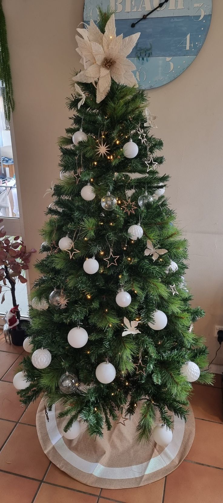 a small christmas tree with ornaments on it