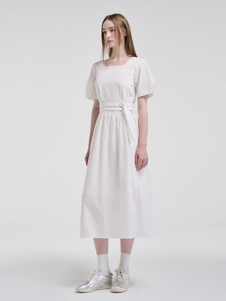 This product is designed with versatility in mind, featuring a 2-way sleeve that allows for multiple styling options. The inclusion of a belt accentuates the waistline, providing a flattering silhouette to this belted dress. Its mid-length hem offers a classic and sophisticated look, suitable for various occasions. - The dress comes with a detachable belt to cinch the waist for a tailored fit.- Puff sleeves can be worn two ways, adding a touch of elegance and adaptability.- Crafted with a subtle A-line cut that gracefully complements the figure.- Complete with a concealed back zipper for a seamless look and easy wear. Casual Spring Dress With Belt Detail, Casual Dresses With Belt Detail For Spring, White Belted Midi Dress For Work, Belted Short Sleeve Maxi Dress For Work, Short Sleeve Belted Maxi Dress For Work, Elegant Belted Dress With Tie Waist For Day Out, Chic Belted Summer Dress, Summer Workwear Maxi Dress With Belt, White Belted Dress For Work