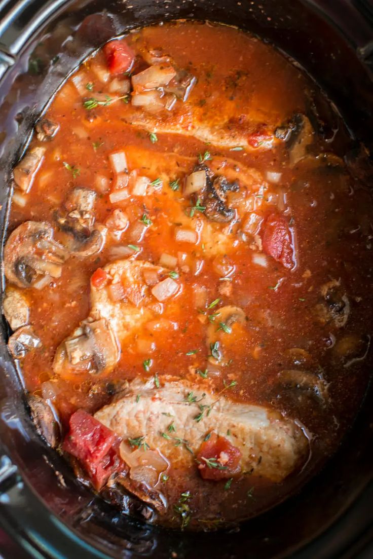 chicken and mushroom stew in the crock pot ready to be cooked on the stove