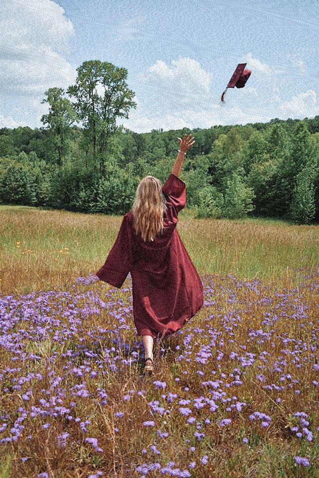 a woman in a red dress flying a kite over a field full of purple flowers