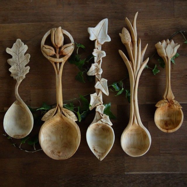 four spoons with flowers and leaves on them